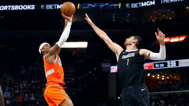 Mar 16, 2024; Memphis, Tennessee, USA; Oklahoma City Thunder guard Shai Gilgeous-Alexander (2) shoots as Memphis Grizzlies forward-center Santi Aldama (7) defends during the first half at FedExForum. 